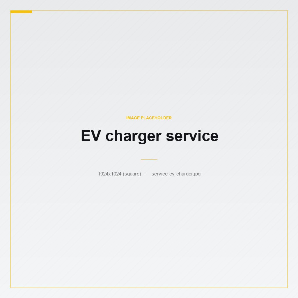 A sleek Level 2 EV charger mounted on a dark garage wall with a coiled cable.
