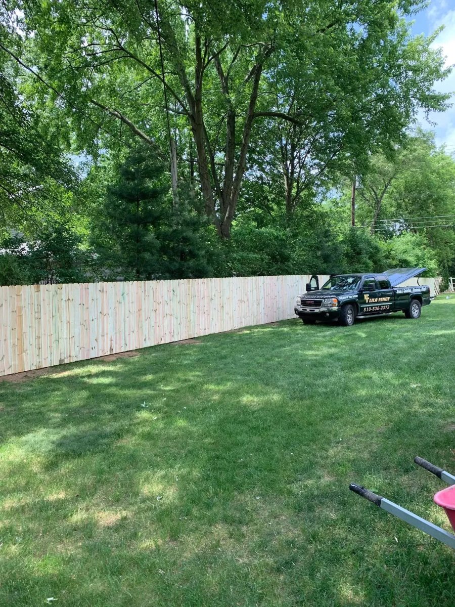 Wood privacy fence installed by the Lila Fence crew