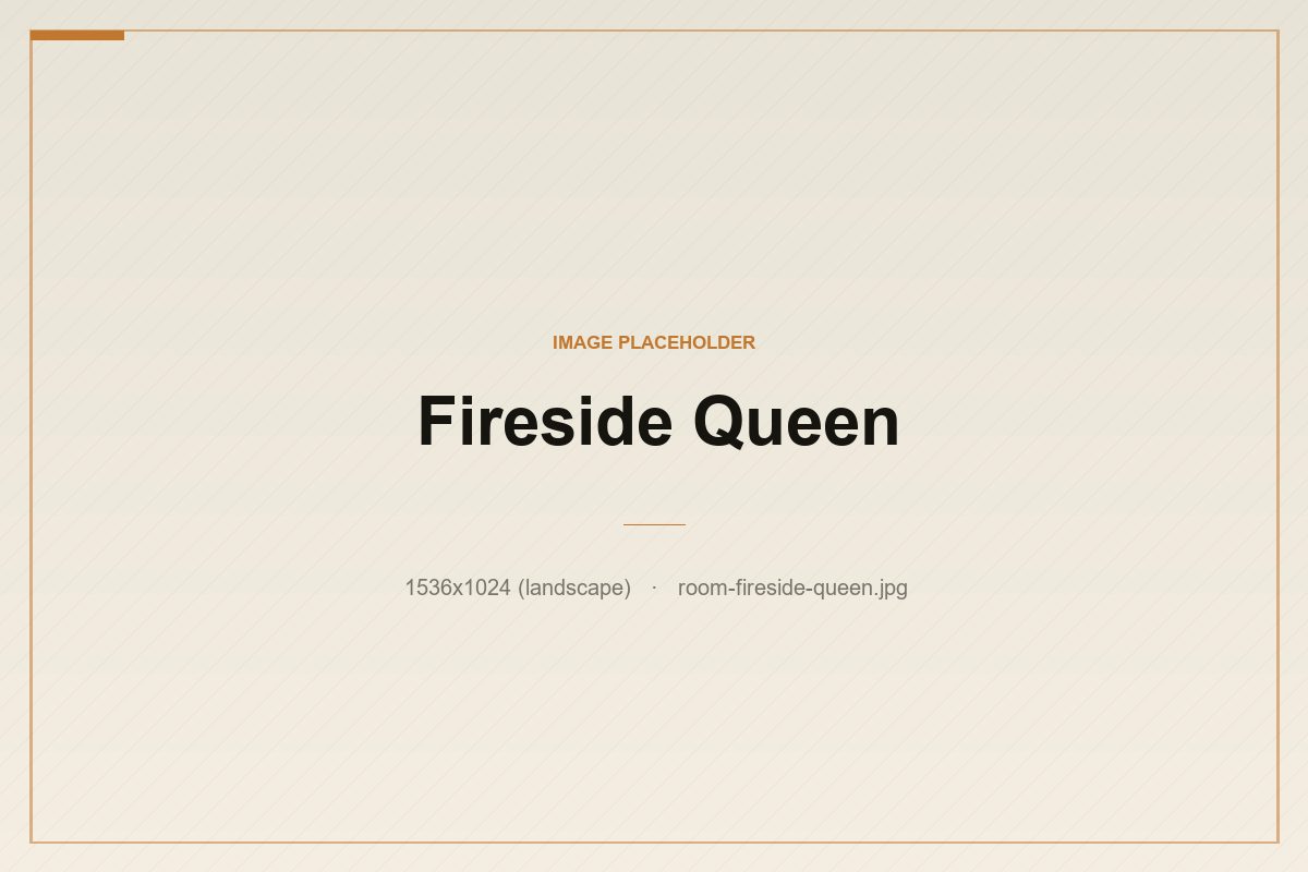 The Fireside Queen — a queen room with a small woodstove