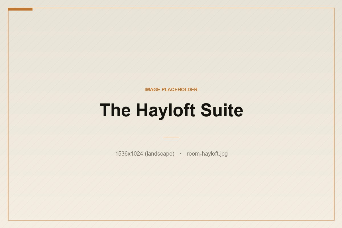 The Hayloft Suite — a converted loft with a sitting area and soaking tub