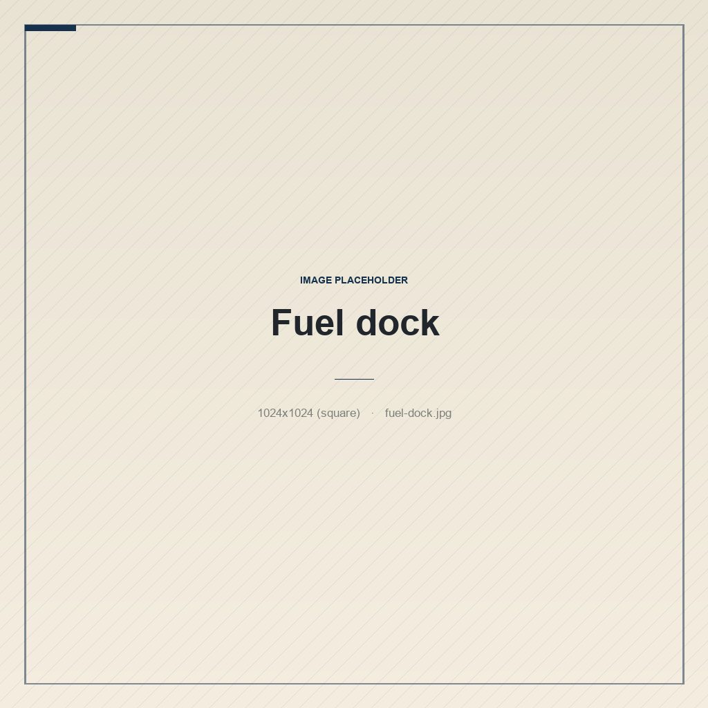 A small marina fuel float with pumps and hoses on a weathered floating dock
